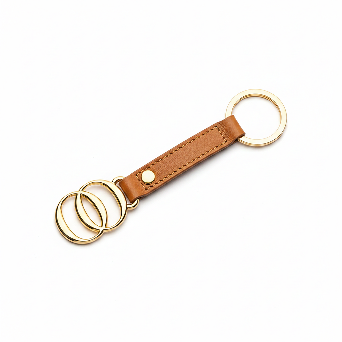 Portachiavi OROORO® in nappa color Praline con finiture dorate su sfondo bianco