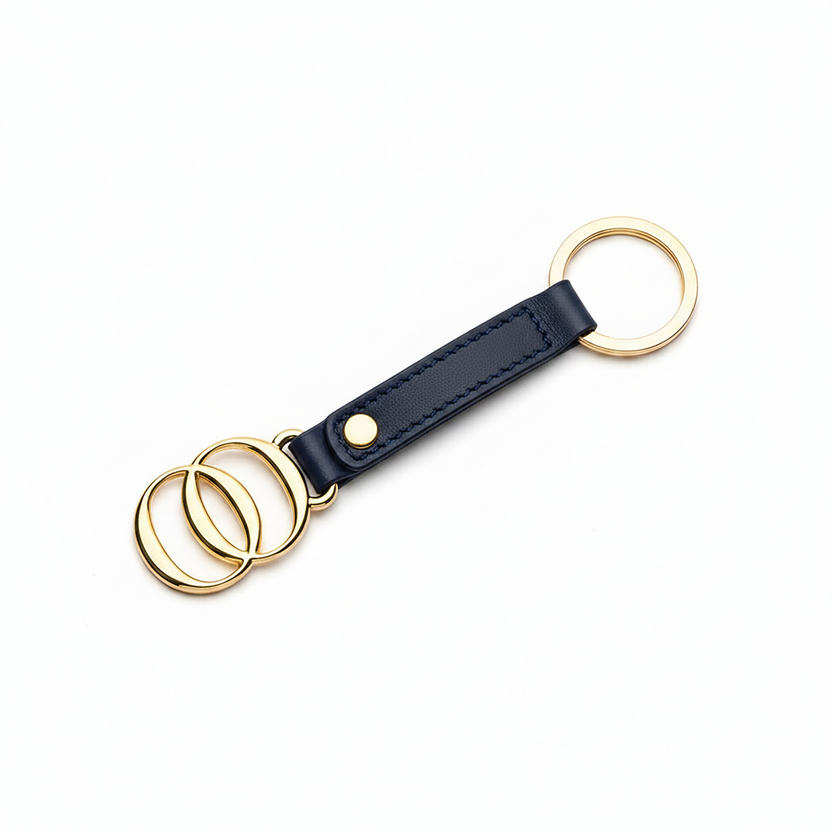 Portachiavi OROORO® in nappa color Deep Navy con finiture dorate su sfondo bianco